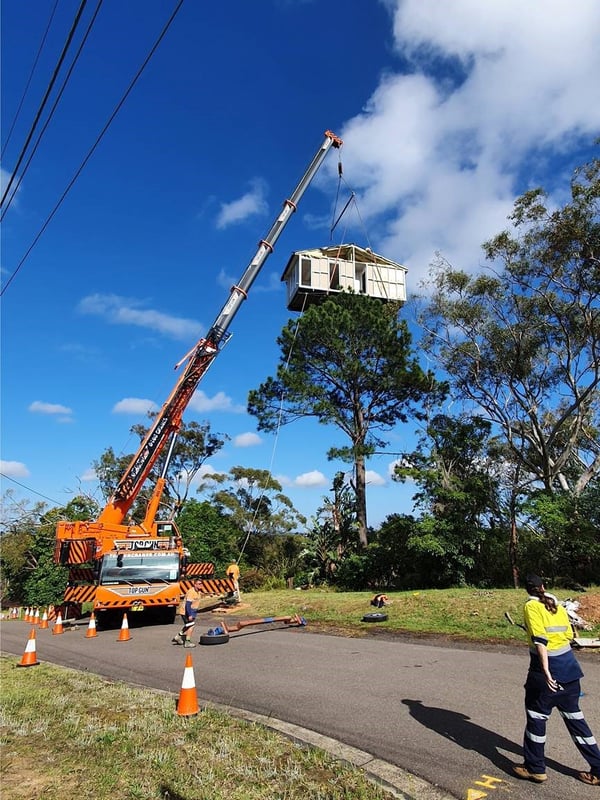 House being craned onto site