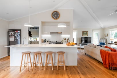 kitchen and living room with raked ceiling