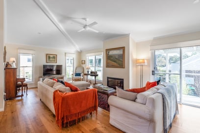 living room with raked ceiling